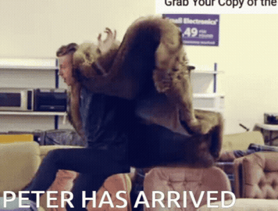 Man In Fur Coat Sitting On Couch Peter Has Arrived GIF