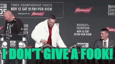 Man In Fur Coat Standing At Podium GIF