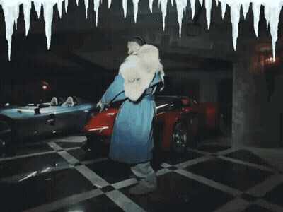 Man In Fur Coat Standing Next To Red Car GIF