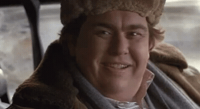 Man In Fur Hat And Fur Coat Smiling GIF