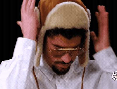 Man In Furry Hat And Glasses Making Funny Face GIF