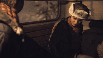 Man In Furry Hat Sitting In Dark Room GIF