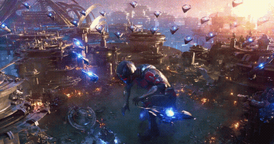 Man In Futuristic Suit Before Futuristic City GIF