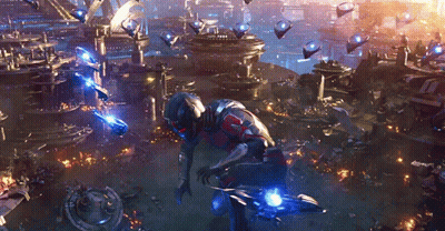 Man In Futuristic Suit In Front Of City GIF