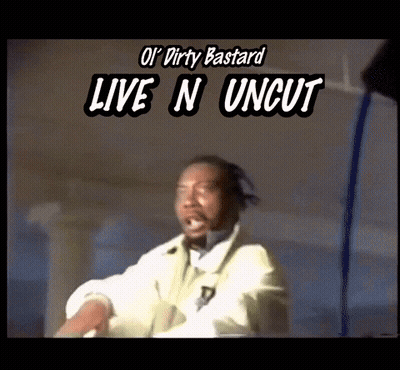 Man In Futuristic Suit Walking Across Bridge With Mountains GIF