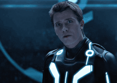 Man In Futuristic Suit With Glowing Chest Circles GIF