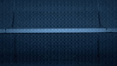 Man In Futuristic Suit With Glowing Circles On Chest GIF