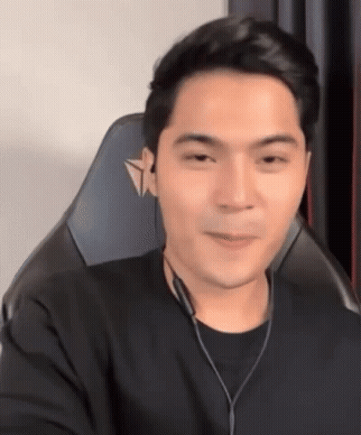 Man In Gaming Chair With Headphones And Black Shirt GIF