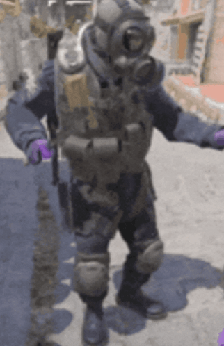 Man In Gas Mask And Purple Gloves On Street GIF