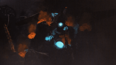 Man In Gas Mask Surrounded By Fire And Smoke GIF