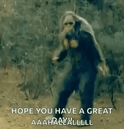 Man In Gas Mask Walking In Woods With Sword GIF