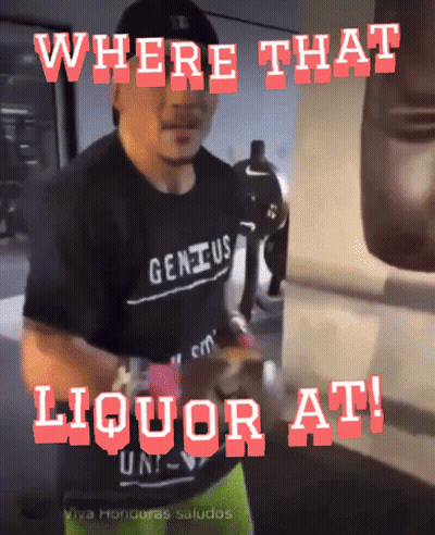 Man In Genius Shirt In Front Of Punching Bag GIF