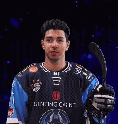 Man In Genting Casino Jersey Holding Hockey Stick GIF