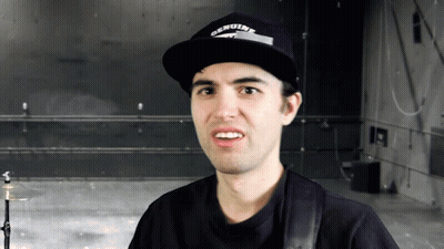 Man In Genuine Hat Looks At Camera GIF