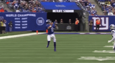 Man In Giants Jersey Holding Sign I Love Daniel Jones And Darius Slayton GIF