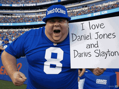 Man In Giants Jersey Holding Sign I Love Daniel Jones And Darius Slayton GIF
