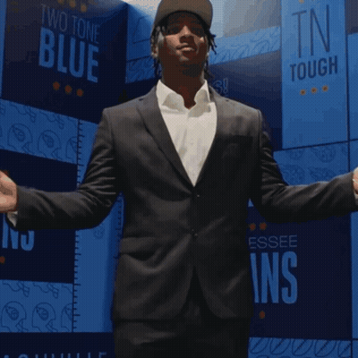 Man In Giants Jersey In Front Of City GIF