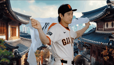 Man In Giants Jersey In Front Of Korean Temple GIF