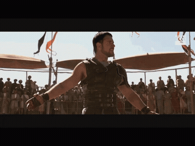 Man In Gladiator Costume Before Crowd With RTL GIF