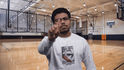 Man In Glasses And 100 Thieves Shirt Giving Peace Sign GIF