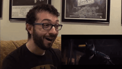Man In Glasses And Batman Shirt Reacts To Batman Movie GIF