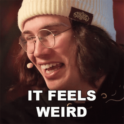 Man In Glasses And Beanie Saying It Feels Weird GIF
