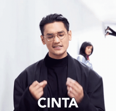 Man In Glasses And Black Jacket Saying Cinta GIF