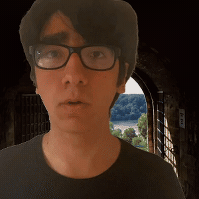 Man In Glasses And Black Shirt At Doorway GIF