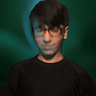 Man In Glasses And Black Shirt Making A Face GIF