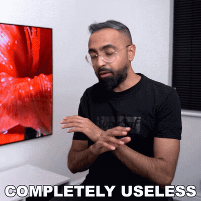 Man In Glasses And Black Shirt Saying Completely Useless GIF