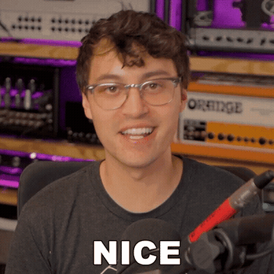 Man In Glasses And Black Shirt Saying Nice GIF