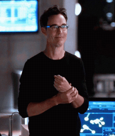 Man In Glasses And Black Shirt Smiling At Monitor GIF