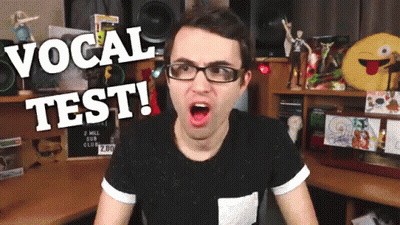 Man In Glasses And Black Shirt Vocal Test GIF
