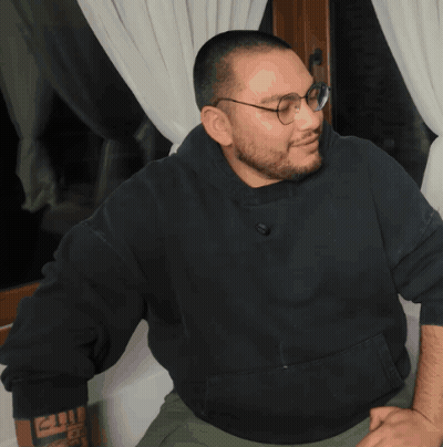 Man In Glasses And Black Sweatshirt Saying 2011 GIF