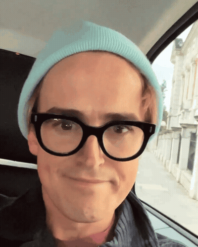 Man In Glasses And Blue Beanie Smiling GIF
