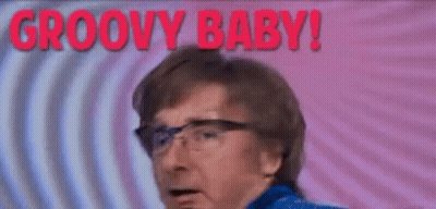 Man In Glasses And Blue Jacket Making Funny Face GIF