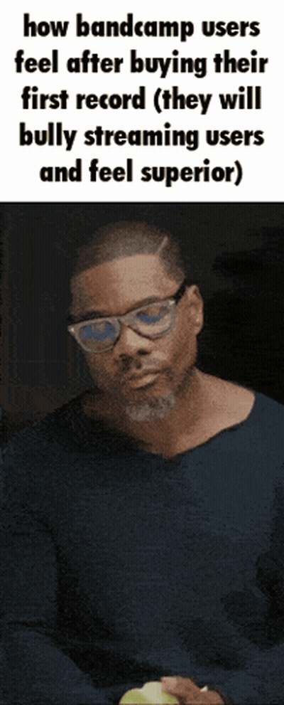 Man In Glasses And Blue Shirt Holding Green Apple GIF