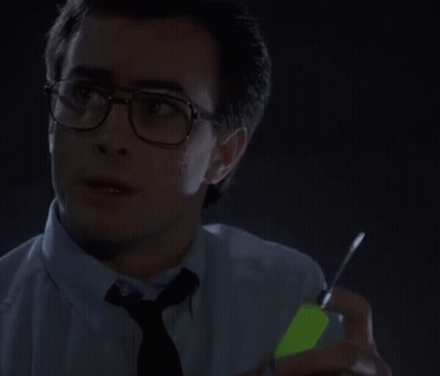 Man In Glasses And Blue Shirt Looking At Watch GIF