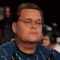 Man in Glasses and Blue Shirt Making a Face
