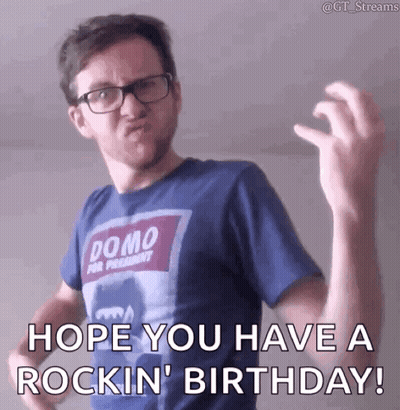 Man In Glasses And Blue Shirt Saying Hope You Have A Rockin Birthday GIF