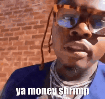 Man In Glasses And Blue Shirt Saying Ya Money Shrimp GIF