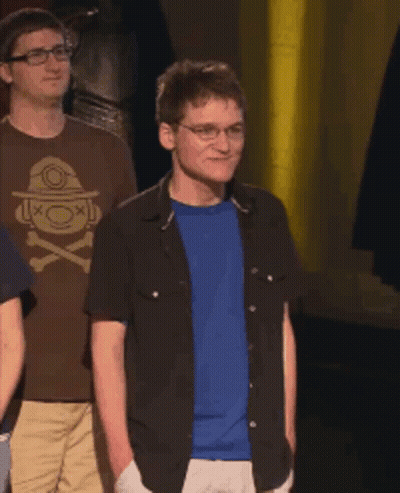Man In Glasses And Blue Shirt With Acksyzu Sticker GIF