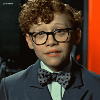 Man In Glasses And Blue Sweater Making Funny Face GIF
