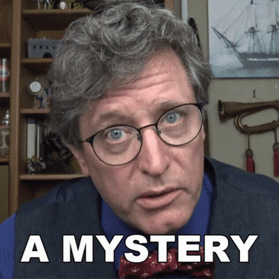 Man in Glasses and Bow Tie Saying A Mystery