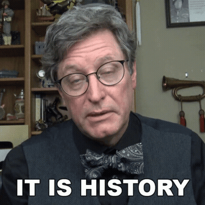 Man in Glasses and Bow Tie Saying It Is History