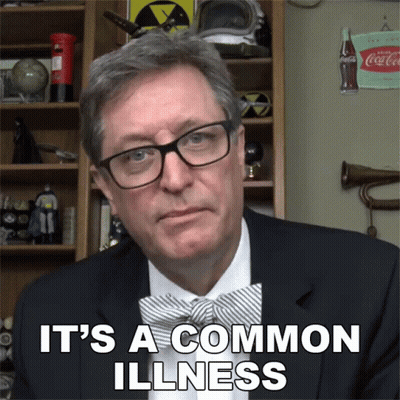 Man In Glasses And Bow Tie Says It's A Common Illness GIF