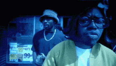 Man In Glasses And Bucket Hat At 99 Cents Sign GIF