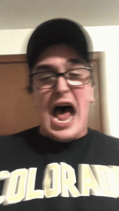Man In Glasses And Colorado Shirt Making Face GIF