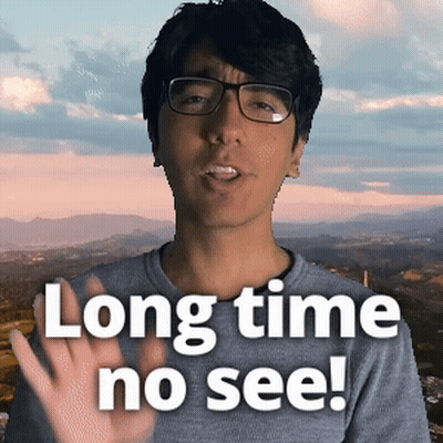 Man In Glasses And Gray Shirt Says Long Time No See GIF