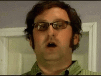 Man In Glasses And Green Shirt Open Mouth GIF